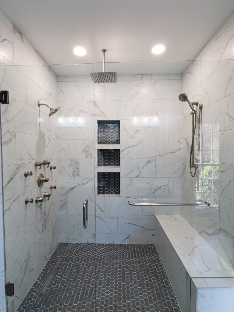 Modern bathroom remodel with custom tile shower and bench in Wake County, NC